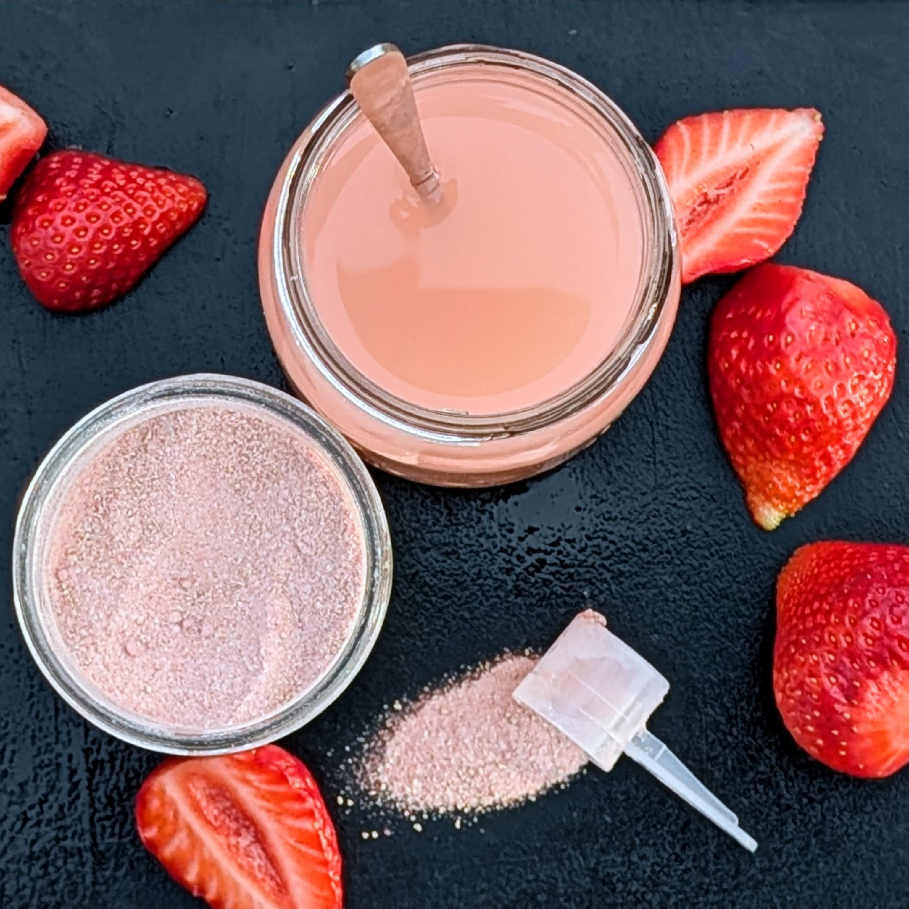 overhead view of Rill Hydration strawberry electrolyte drink mix surrounded by strawberries 